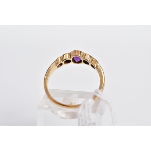 23 - A 9CT GOLD AMETHYST AND DIAMOND RING, designed with a central oval amethyst in a collet setting with... 