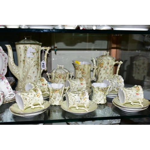 254 - A FRENCH PORCELAIN COFFEE SET, floral and gilt detail, a pale yellow ground, comprising coffee pot, ... 