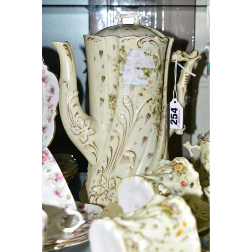 254 - A FRENCH PORCELAIN COFFEE SET, floral and gilt detail, a pale yellow ground, comprising coffee pot, ... 