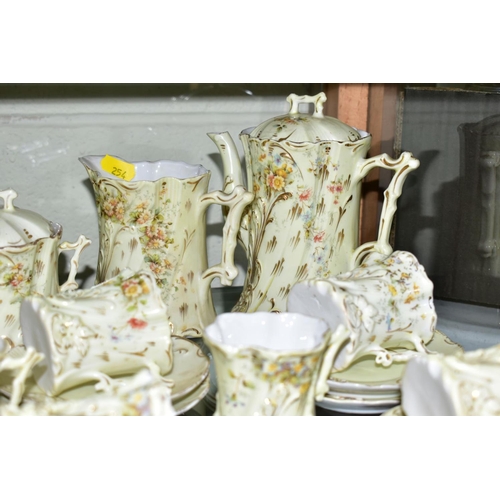 254 - A FRENCH PORCELAIN COFFEE SET, floral and gilt detail, a pale yellow ground, comprising coffee pot, ... 