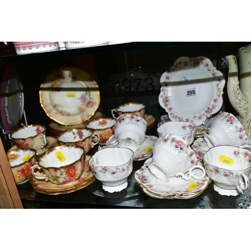 255 - AN EARLY AYNSLEY TEASET, Rd No 334379, floral pattern edging on white ground, comprising six side pl... 