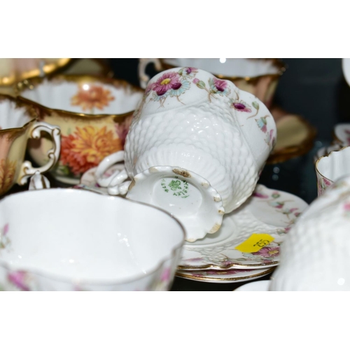 255 - AN EARLY AYNSLEY TEASET, Rd No 334379, floral pattern edging on white ground, comprising six side pl... 