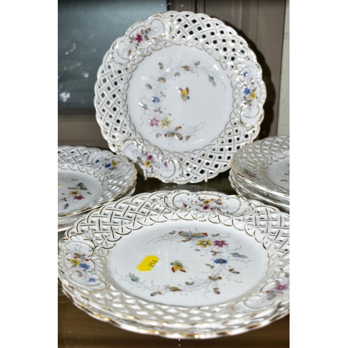 256 - A TWELVE PIECE GERMAN PORCELAIN DESSERT SET, No 2270 butterfly and foliage pattern with pierced edgi... 