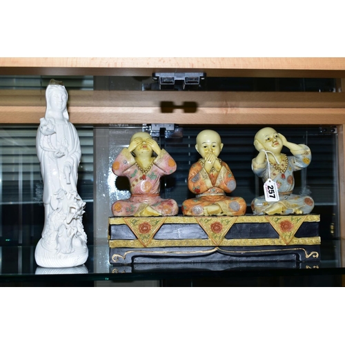 257 - A MODERN FIGURE GROUP OF BUDDHAS, in the See No Evil, Hear No Evil and Speak No Evil positions, heig... 