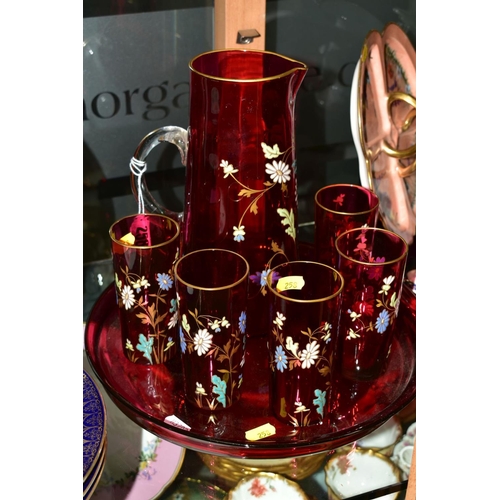 258 - A FLORALLY ENAMELLED CRANBERRY GLASS LEMONADE SET, comprising a jug, height 25cm and five matching g... 