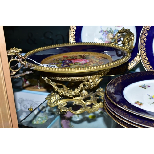 259 - A SEVRES PORCELAIN GILT METAL TWIN HANDLED MOUNTED COMPORT, with handpainted floral decoration, heig... 