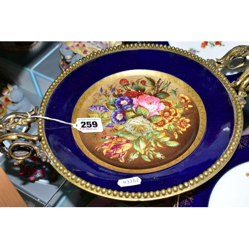 259 - A SEVRES PORCELAIN GILT METAL TWIN HANDLED MOUNTED COMPORT, with handpainted floral decoration, heig... 