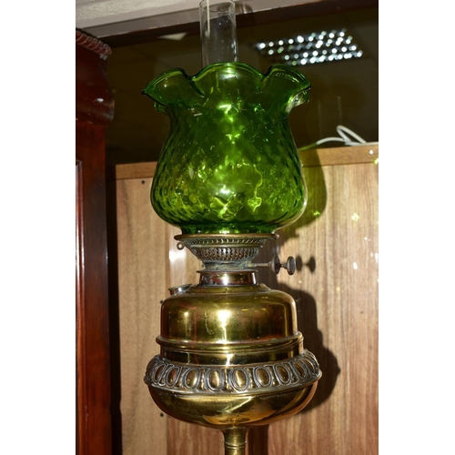 282 - A LATE 19TH/EARLY 20TH CENTURY BRASS OIL LAMP, having brass reservoir, glass funnel and green glass ... 