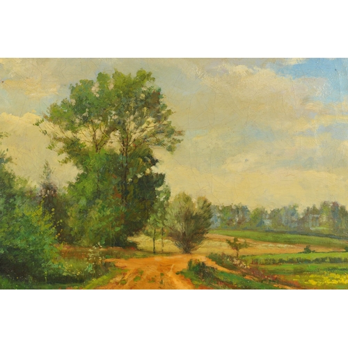 612 - J.P. GUILLOTEAU (20TH CENTURY), a dirt road winding through a rural landscape, trees to the left, op... 