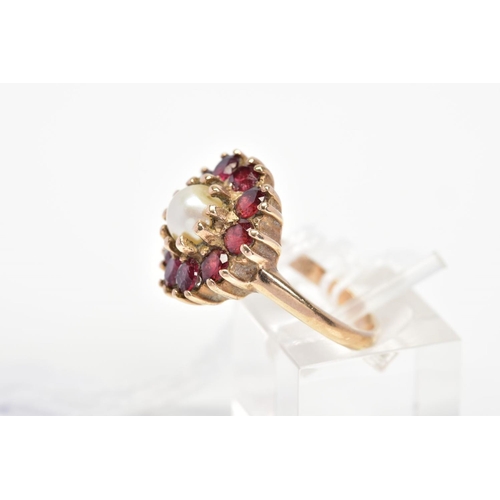 29 - A 9CT GOLD CULTURED PEARL AND GARNET CLUSTER RING, designed with a central cultured pearl in a circu... 