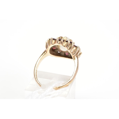 29 - A 9CT GOLD CULTURED PEARL AND GARNET CLUSTER RING, designed with a central cultured pearl in a circu... 