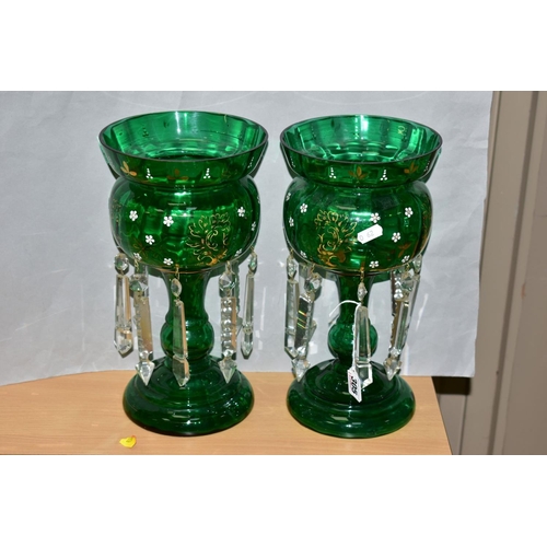 305 - A PAIR OF GREEN CONTINENTAL GLASS LUSTRES, having gilt and white enamel floral decoration, with cut ... 