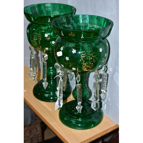 305 - A PAIR OF GREEN CONTINENTAL GLASS LUSTRES, having gilt and white enamel floral decoration, with cut ... 