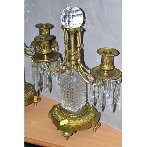 308 - A PAIR OF GILT METAL AND CRYSTAL CANDELABRA, each consisting of two arms attached to a central colum... 