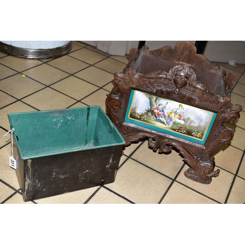 311 - A 19TH CENTURY BLACK FOREST WOODEN PLANTER, with porcelain panel depicting a male figure playing the... 