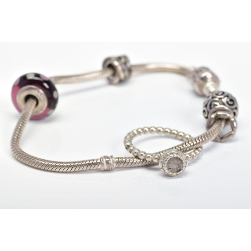 32 - A PANDORA BRACELET AND PANDORA RING, the charm bracelet suspending four charms, together with a Pand... 