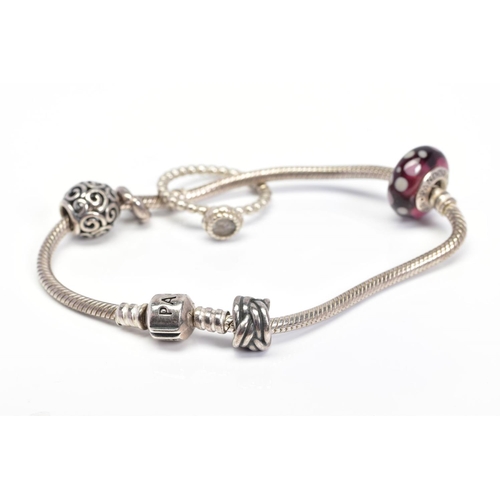 32 - A PANDORA BRACELET AND PANDORA RING, the charm bracelet suspending four charms, together with a Pand... 