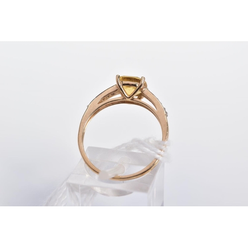 33 - A 9CT GOLD CITRINE RING, designed with a central cushion shape citrine and circular colourless gems ... 