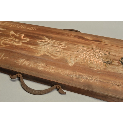 1381 - A 19TH CENTURY CHINESE HARDWOOD BOARD CARVED WITH SCRIPT AND SEALS, traces of gilding, fitted with a... 