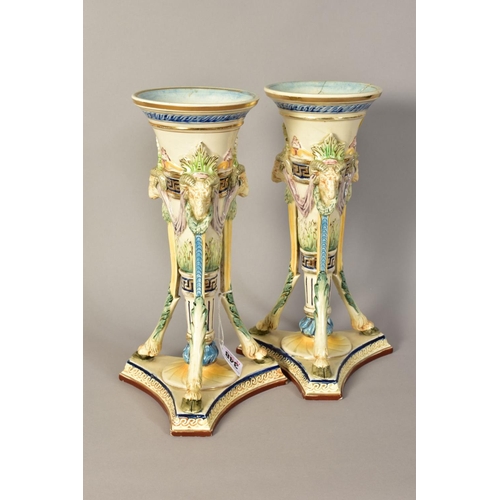 348 - A PAIR OF CONTINENTAL MAJOLICA HUGO LONITZ VASES, of trumpet form having Rams head masks supported o... 