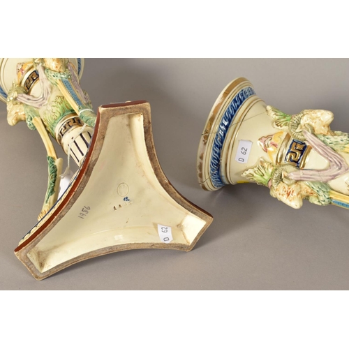 348 - A PAIR OF CONTINENTAL MAJOLICA HUGO LONITZ VASES, of trumpet form having Rams head masks supported o... 