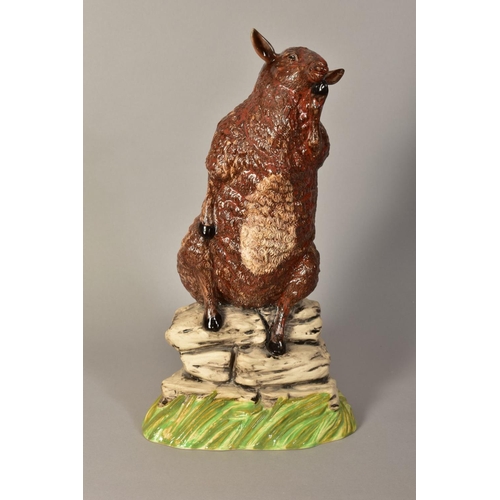 350 - A BURSLEM POTTERY FIGURE OF A SHEEP, 'The Thinker', impressed marks to base, height approximately 37... 