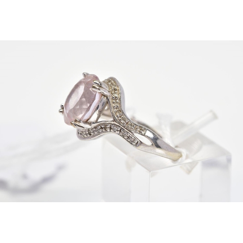 36 - A 9CT WHITE GOLD KUNZITE AND DIAMOND RING, designed as a central oval kunzite within a single cut di... 