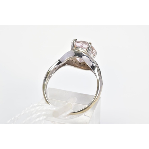 36 - A 9CT WHITE GOLD KUNZITE AND DIAMOND RING, designed as a central oval kunzite within a single cut di... 