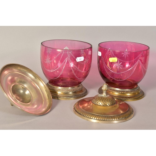 380 - A PAIR OF CRANBERRY COLOURED BISCUIT BARRELS (?), with plated covered and plated bases, heights appr... 