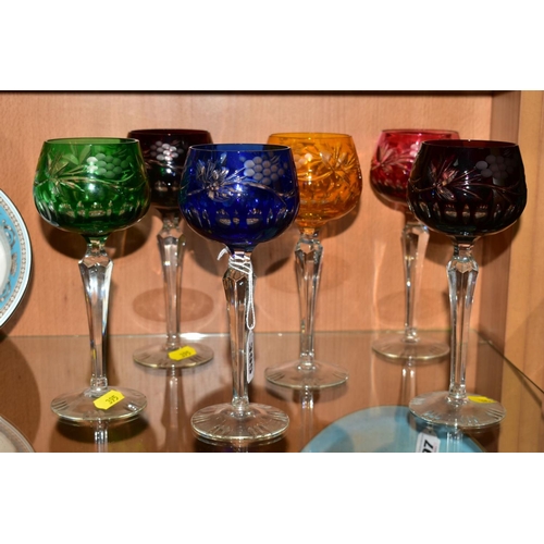 395 - A SET OF SIX HARLEQUIN HOCK GLASSES, etched with berries and foliage (6)