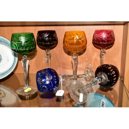 395 - A SET OF SIX HARLEQUIN HOCK GLASSES, etched with berries and foliage (6)