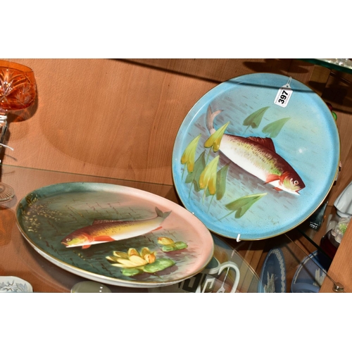 397 - A PAIR OF LIMOGES CIRCULAR TRAYS/PLATTERS, decorated with Fish, diameters 29cm (2)