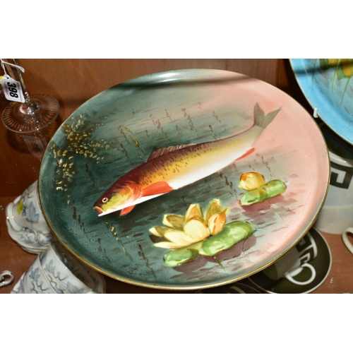 397 - A PAIR OF LIMOGES CIRCULAR TRAYS/PLATTERS, decorated with Fish, diameters 29cm (2)