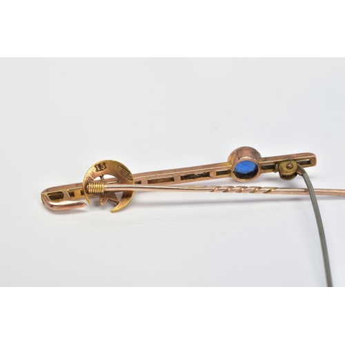 42 - AN EARLY 20TH CENTURY BROOCH AND STICKPIN, the bar brooch with off set circular blue paste in a coll... 