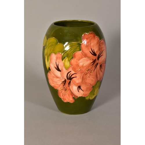 448 - A MOORCROFT POTTERY VASE, 'Hibiscus' pattern on green ground, impressed backstamp and painted signat... 