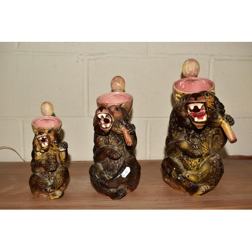 457 - A GRADUATED SET LOF THREE MAJOLICA STYLE BEARS, the handles modelled as spoons, largest height 33cm ... 