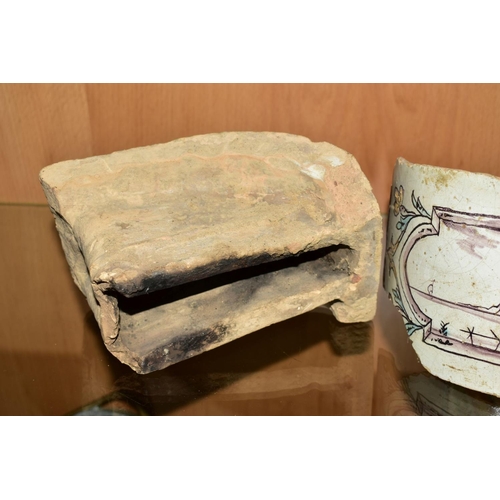 463 - A PAIR OF 18TH CENTURY FAIENCE ROUNDED CORNER FIREPLACE TILES/BRICKS, both painted with landscapes w... 