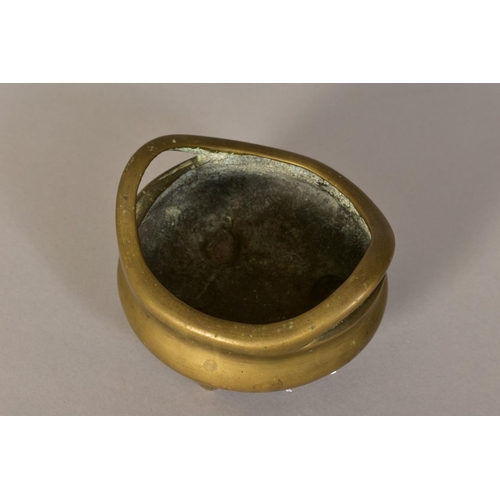 466 - A CHINESE POLISHED BRONZE TRIPOD CENSER, 18th / 19th Century, looped handles, cast mark to underside... 