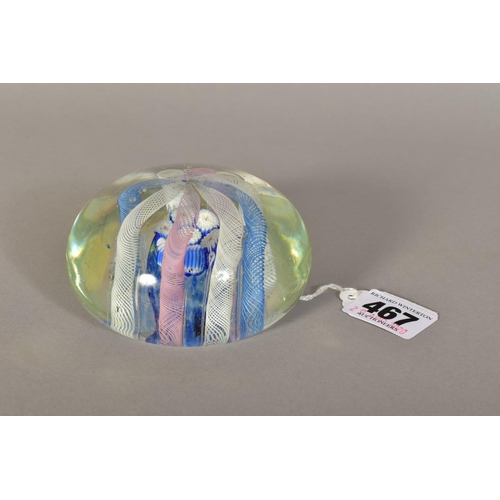 467 - A 20TH CENTURY FRENCH GLASS PAPERWEIGHT, the clear glass containing eight coloured air twists arched... 