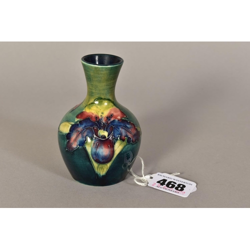 468 - A SMALL MOORCROFT POTTERY BUD VASE, 'Orchid' pattern on green ground, Queen Mary paper label to base... 