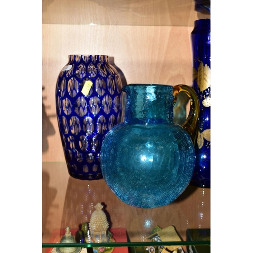 472 - A PAIR OF MODERN BLUE GLASS BASKETS with wavy edges, approximate height 26cm, a pair of cut blue gla... 