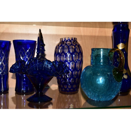 472 - A PAIR OF MODERN BLUE GLASS BASKETS with wavy edges, approximate height 26cm, a pair of cut blue gla... 