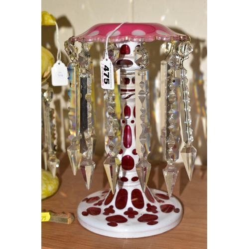 475 - A BOHEMIAN WHITE OVERLAY ON CRANBERRY GLASS LUSTRE, with clear glass lustres, height 26.5cm (one dro... 