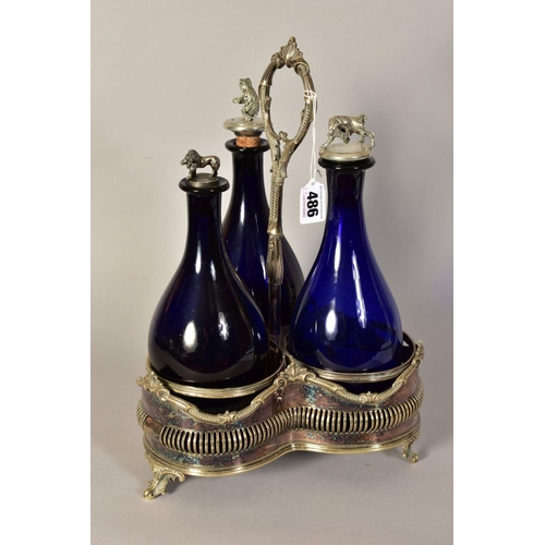 486 - A VICTORIAN PLATED TREFOIL DECANTER STAND, containing three blue glass decanters with novelty stoppe... 