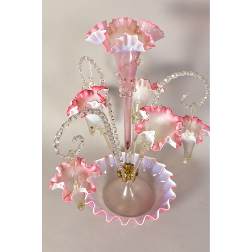 487 - A VICTORIAN VASELINE GLASS EPERGNE, with central frilled pink trumpet vase, framed by three further ... 