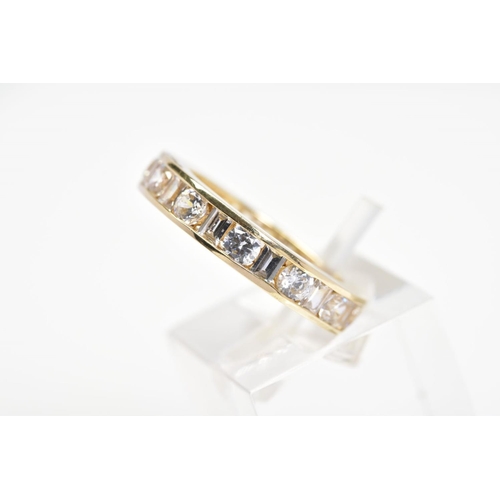 54 - A 14CT GOLD CUBIC ZIRCONIA ETERNITY RING, designed as channel set circular and rectangular colourles... 