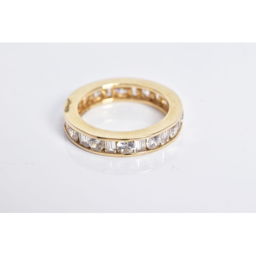 54 - A 14CT GOLD CUBIC ZIRCONIA ETERNITY RING, designed as channel set circular and rectangular colourles... 