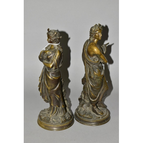 560 - A PAIR OF 19TH CENTURY CONTINENTAL BRONZE FIGURES, in the form of a classical male holding a compani... 