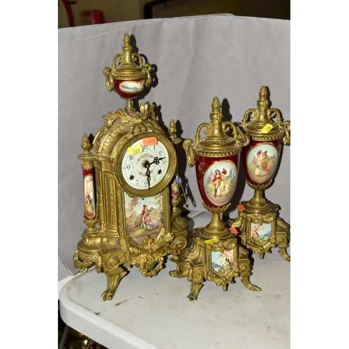 565 - A FRANZ HERMLE & SONS OF GERMANY BRASS CLOCK GARNITURE IN THE LOUIS XIV STYLE, painted porcelain pan... 