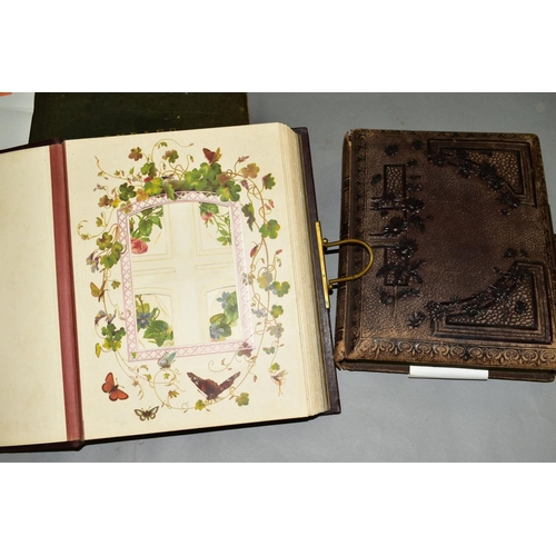 570 - TWO VICTORIAN/EDWARDIAN PHOTOGRAPH ALBUMS, leather bound with brass clasps, partially lithographed i... 